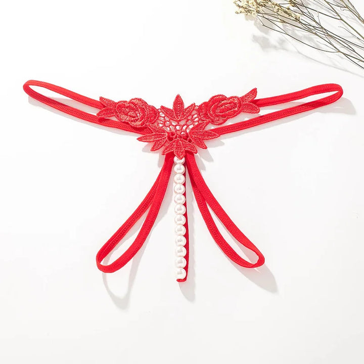 Tanga con abertura y ribete de perlas